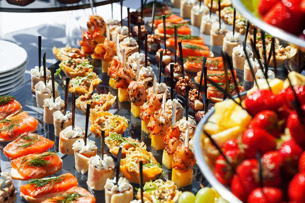 A buffet table with many different types of food.