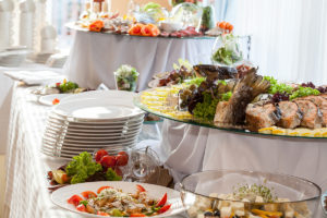 Romantic wedding catering setup with gourmet dishes by Pear Tree